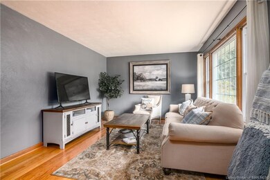 Main floor living room with original hardwood floo