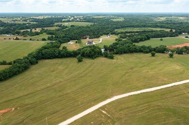 Birds eye view of property with a rural view