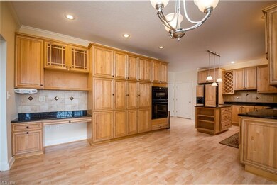 Many Cabinets in this wonderful Kitchen