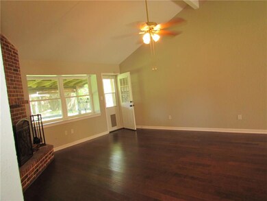Den with vaulted ceiling and beautiful engineered