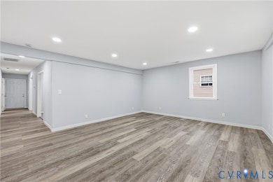 Unfurnished room featuring light wood-style floors and recessed lighting