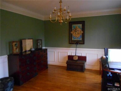 Formal Dining Room with Crown Molding/Wainscoting/