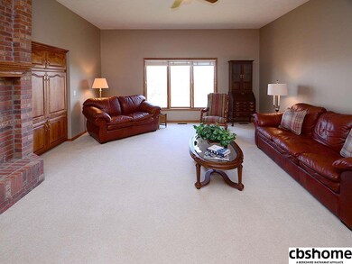 This Large Family Room has the potential to be opened to the kitchen by removing the wall right of the fireplace.