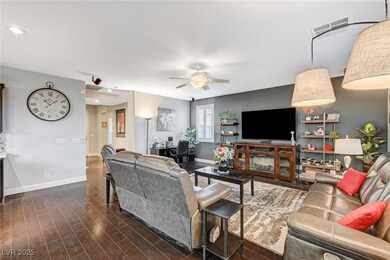 Living area featuring dark wood-type flooring, shu