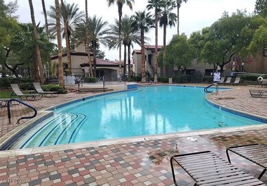 Community pool featuring a patio