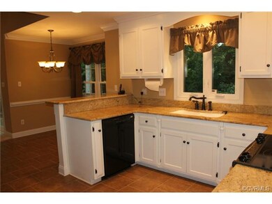 Eat-in kitchen overlooks private rear yard