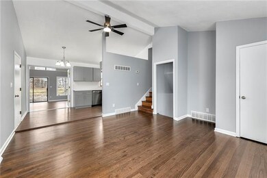 Living room leads to dining area and kitchen