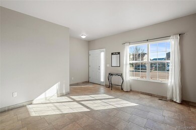 Front family room with tile floors and accent wall