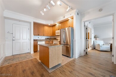 Kitchen with sink, ornamental molding, a center is