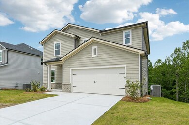 Traditional-style house with central AC, driveway,
