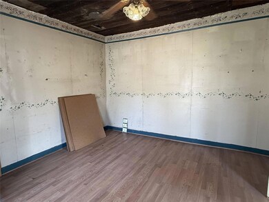 Empty room featuring hardwood / wood-style floors