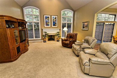 Great Room with Vaulted Ceiling & Fireplace