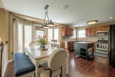 Kitchen has granite counters and a movable island.