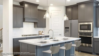 Kitchen featuring stainless steel appliances, a s