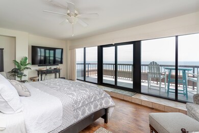 Primary bedroom with wall-to-wall, floor-to-ceilin
