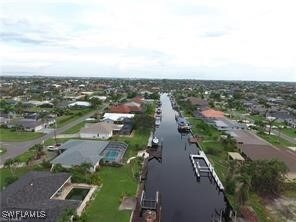 Aerial view of property and surrounding area with