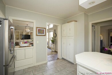 Kitchen connects to both living areas and the dini