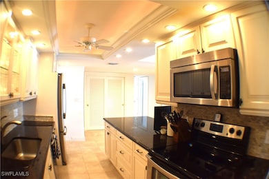 Kitchen with granite countertops, decorative backs