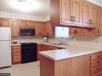 The updated kitchen features beautiful, oak cabine