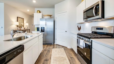 Kitchen featuring sink, hardwood / wood-style floo