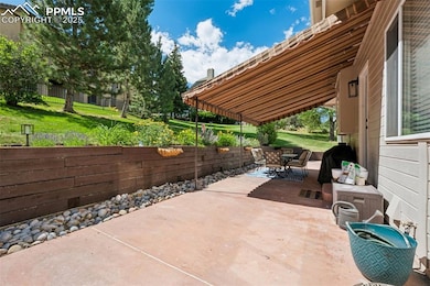 View of patio with outdoor dining area