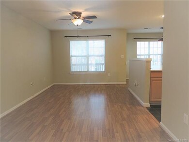 Large Living area with Laminate wood flooring; ope