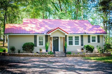 View of front of property featuring a metal roof