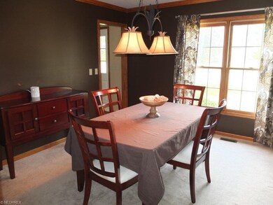 Formal dining room with crown molding.
