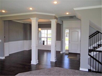 Front entry and formal dining room.