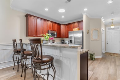 Kitchen featuring crown molding, appliances with s