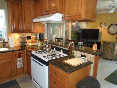 View of kitchen into family room