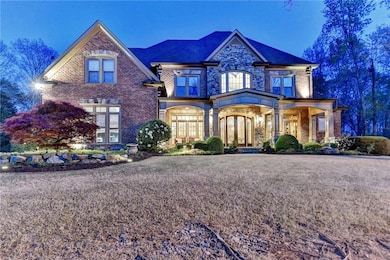 View of front of property with brick siding and french doors