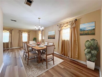 Dining room is virtually staged.