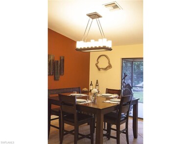 Dining room leads onto the lanai.