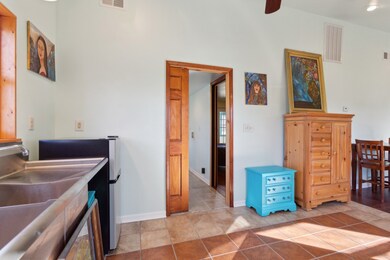 Pocket door to utility room from Kitchen area