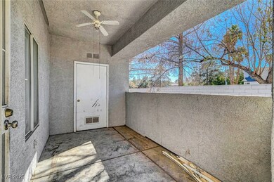 Balcony with visible vents and a ceiling fan