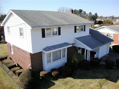 Elevated view  of front and side showing manicured