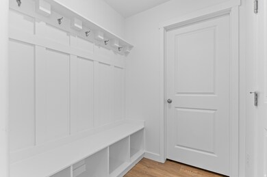 Mudroom featuring light wood-style floors