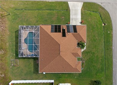 view of the pool and solar heating panels