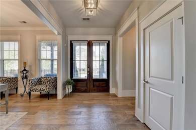 Entrance foyer featuring light wood finished floor
