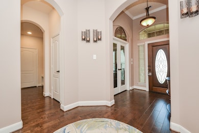 As you enter the elegant foyer, you will discover a study complimented by glass French doors