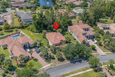 Aerial perspective of suburban area with a nearby body of water