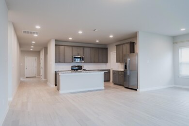 Kitchen with baseboards, stainless steel applianc