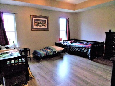 Bedroom -  One of the 3 bedrooms.  Wood laminate f