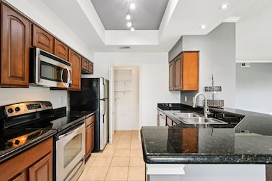 Kitchen featuring appliances with stainless steel