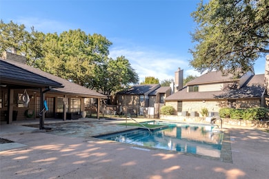 Community pool featuring a patio area