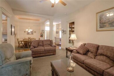 The view from the Great Room looking back at the Formal Dining Room and the front entry.  Take notice of the built-in shelves in the hallway to the Master Bedroom.
