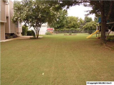 LOTS OF GRASS TO RUN AND PLAY--ENTERTAIN FRIENDS AND FAMILY INSIDE OR OUT. YOU'LL LOVE THE CUSTOM DESIGNED PATIO.