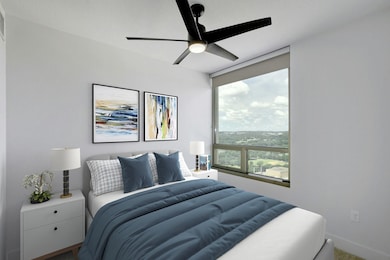 Bedroom featuring baseboards, carpet floors, and 