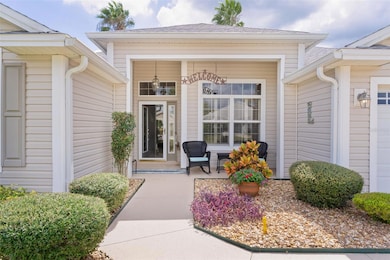 Enjoy morning java or evening refreshments on this inviting covered front porch. Now let's step thru this beautiful cut-glass entry door.